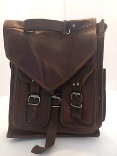 This is nice full grain leather backpack that it is already broken. The rugged look gives this  bacpack a lots of character but the soft leather makes it confortable on your back. Can be wore as a back pack or messenger bag. It is already treated with waterproof mink oil Rugged Leather Satchel Backpack, Vintage Brown Leather Backpack With Soft Leather, Brown Waxed Finish Backpack Shoulder Bag, Brown Waxed Finish Shoulder Backpack, Vintage Brown Soft Leather Backpack, Adventure Leather Satchel Backpack With Leather Backing, Brown Leather Satchel Backpack For Outdoor, Rugged Rectangular Brown Backpack, Vintage Brown Leather Satchel Backpack For Everyday Use