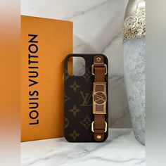 a louis vuitton phone case next to an orange box