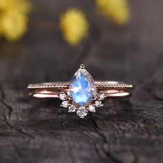 https://bbbgem.com/product/solitaire-rainbow-pear-moonstone-diamond-engagement-ring-set/?ref=iykwuu3z1v #engagementring #anniversarygift #solitaire Black Opal Engagement Ring, Rainbow Moonstone Engagement Ring, Moonstone Engagement Ring Rose Gold, Opal Engagement Ring Set, Moonstone Engagement Ring Set, Vintage Gold Engagement Rings, Rose Gold Plated Ring, Antique Engagement Ring, Moonstone Engagement