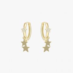 Borrowing inspiration from star constellations, these gold-tone plated earring hoops feature gold hoop with a gleaming star set on and two gold stars hanging. The simple yet trendy design is sure to bring luck and vibrance to any charm outfit.Materials & Finishing: 14K Gold plated sterling brass, 925 silver needleStone: ZirconMeasurements：Diameter: 12mmAllergy Information: Hypoallergenic Tarnish Resistant Star Earrings, Huggie Earrings With Star Charm, Hoop Earrings With Star Charm, Hoop Huggie Earrings With Star Charm, Earring Hoops, Luxury Jewelry Brands, Star Constellations, Star Pendant, Gold Hoop