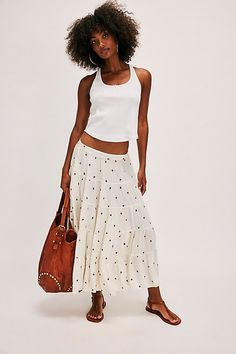 Our beloved In Full Swing midi skirt — now with a sweet embroidered finish! **Fit:** Low-slung, billowy silhouette **Features:** Textured embroidered detailing, lightweight design, stretchy elastic waistband, tiered seaming, A-line hem **Why We ❤ It:** This timeless skirt can be dressed up with your favorite femme corset or dressed down with a playful baby tee. | In Full Swing Embroidered Midi Skirt by Free People in White, Size: XL White Embroidered Maxi Skirt For Spring, Casual Summer Skirt With Embroidered Hem, Casual Embroidered Tiered Skirt, Casual Embroidered Tiered Skirt Bottoms, Embroidered Midi Skirt For Summer, Embroidered Flared Skirt For Summer, Embroidered Tiered Skirt For Summer, Embroidered Flowy Maxi Skirt For Summer, Summer Embroidered Flowy Maxi Skirt