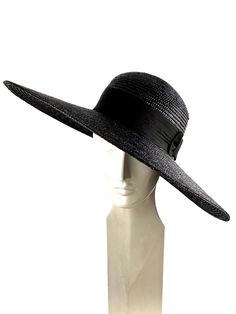 Elegant woman summer hat made with black natural straw braid of 8/9 millimeters wide. Adorned with a good quality 50mm wide black grosgrain ribbon with a bow onside the hat. The measurements in centimeters are 50 x 48. Brim length 15. (These measurements may vary slightly depending on the size of the hat) For its elaboration we only use very good quality and resistant straw braids. In our workshop in the Pyrenees we sew and work one by one our hats with wooden molds of our own design. For other Chic Fitted Sun Hat For The Beach, Chic Fitted Hat For The Beach, Chic Fitted Beach Hat, Chic Fitted Boater Hat For Vacation, Black Straw Hat With Curved Brim For Pool, Fitted Brimmed Boater Hat For The Beach, Fitted Fedora Sun Hat For The Beach, Fitted Flat Brim Sun Hat For The Beach, Fitted Wide Brim Panama Hat For Beach