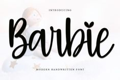 the word barbieie is written in black ink on a white background with gold stars