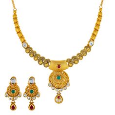 Embrace the rich heritage of Indian craftsmanship with this exquisite 22k antique gold jewelry set by Virani Jewelers. Featuring intricate designs and vibrant gemstones, both the gold necklace and matching earrings is a testament to elegance and refinement. Indulge in the beauty of antique gold and gemstone jewelry and make a statement of sophistication with this stunning gold jewelry set.Features• 22k yellow gold• Emeralds• Kundans• Ruby• Antique finish• Engraved detailsNecklace Specifications: Gold Jewelry Set, Gold Jewelry Sets, Antique Gold Jewelry, Intricate Designs, Antique Finish, Matching Earrings, Antique Gold, Jewelry Set, Gemstone Jewelry