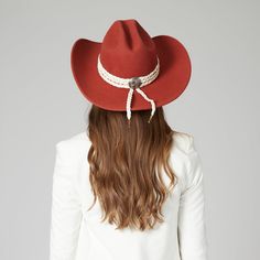 A chic western-inspired rancher cowboy hat featuring a cattleman crease crown. Add some flame to every festival and concert you are planning this year with a hat that will do all the talking fo you. Triple braided wrap trim and the back western concho adds more to the flair. ? Features : Brim Size: 3.75" 100% wool Color: Rust Women's one size ( 57 cm, 22.5 inches) Adjustable internal drawstring for a tighter fit Triple braided wrap trim with back western concho Western Hat Band For Rodeo With Curved Brim, Western Curved Brim Hat Bands For Rodeo, Western Brimmed Hat Bands For Ranch, Western Hats For Ranch, Fitted Western Hat For Western-themed Events, Western Felt Hat For Rodeo, Western Style Felt Hat For Rodeo, Fitted Western Straw Hat For Ranch, Southwestern Wide Brim Felt Hat For Western-themed Events