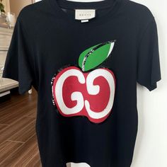 New With Tags, Purchased For 690 Plus Tax Red Gucci Cotton Top, Casual Red Gucci Tops, Gucci Designer Black T-shirt, Gucci Black Short Sleeve Tops, Gucci Black T-shirt With Logo Print, Designer Red Tops With Logo Print, Designer Gucci Black T-shirt, Black Gucci Short Sleeve T-shirt, Gucci Top