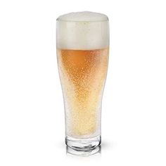 a tall glass filled with beer on top of a white table