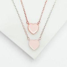 Pink enamel heart necklace on adjustable chain. Available in Sterling Silver and Rose Gold plated sterling silver 8mm Heart Blush Enamel Detail Fully Adjustable: 14 Inches Long With a 2 Inch Extender. Can be Worn at 14, 15 or 16 Inches Rose Gold Double Heart Charm Necklace For Valentine's Day, Rose Gold Double Heart Charm Necklace With Delicate Chain, Valentine's Day Rose Gold Charm Necklace With Delicate Chain, Rose Gold Heart Beads Necklace For Valentine's Day, Rose Gold Charm Necklace For Her On Valentine's Day, Rose Gold Heart Necklace With Adjustable Chain, Delicate Double Heart Rose Gold Necklace, Valentine's Day Rose Gold Sterling Silver Charm Necklace, Delicate Rose Gold Heart Necklace For Mother's Day