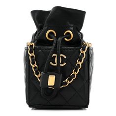 This is an authentic CHANEL Calfskin Quilted Mini Drawstring Bucket Bag in Black. This chic shoulder bag is crafted of luxurious diamond-quilted calfskin in black. The bag features a leather-threaded gold chain shoulder strap and a flap with a matching gold classic CC turn lock. The flap opens to a black leather and fabric interior. 1398289 High-end Quilted Shoulder Bag For Formal Occasions, High-end Black Quilted Bag, High-end Quilted Bags For Formal Occasions, High-end Quilted Formal Bag, High-end Formal Quilted Bags, Quilted Black Bags For Everyday Luxury, Luxury Shoulder Bag With Diamond Quilting For Everyday, Everyday Luxury Black Quilted Bag, Luxury Evening Shoulder Bag With Diamond Quilting