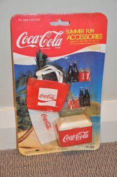 an unopened coca - cola cooler and other items