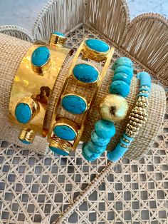 Discover the exquisite Byzantine Turquoise Cuff, a remarkable testament to craftsmanship. This bracelet is lovingly handcrafted in the USA by a talented mother-daughter duo from Handmade Chakarr Jewelry. It features five stunning turquoise stones, delicately cradled in bezel settings and adorned with a gleaming gold-plated finish. Made in the USA. Artisan Turquoise Beaded Bangle Bracelet, Artisan Turquoise Beaded Bangle Bracelets, Turquoise Stackable Bangle Jewelry, Stackable Turquoise Bangle Jewelry, Blue Cuff Bracelet With Natural Stones, Blue Natural Stones Cuff Bracelet, Turquoise Artisan Cuff Bracelet With Natural Stones, Artisan Turquoise Cuff Bracelet With Natural Stones, Turquoise Natural Stone Cuff Bangle