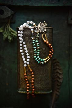 "This smaller size (6mm) mala necklace is made with a powerful combination of white Moonstone, green Chrysoprase, Citrine, tribal brass and slightly fragrant Sandalwood beads. It's finished with an artisan bronze Tree of Life pendant (Crescent Moon on the back side). This delicate and earthy piece is great for new beginnings..! Total necklace length is about 36 inches - the pendant reaches the Solar Plexus on a medium height person. It's lightweight and comfortable to wear everyday - last pictur Bohemian Agate Mala With Gemstone Beads, Spiritual Jade Beaded Necklaces For Meditation, Spiritual Hand-strung Jade Beaded Necklace, Bohemian Aventurine Beaded Necklaces, Jade Beaded Necklaces With Gemstone Beads For Meditation, Bohemian Jade Beaded Necklace With 108 Beads, Bohemian Aventurine Beaded Necklace, White Beaded Necklaces With Natural Stones For Meditation, White Gemstone Beaded Necklaces For Meditation