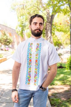 This beautiful Traditional Guayabera for Men is embroidered and adds a sophisticated flare to your wardrobe.  This elegant button up Shirt is perfect for special occasions such as Mexican Fiestas, Quinceañeras, Weddings, etc. More styles available here: https://www.etsy.com/es/shop/SoleiEthnic?ref=seller-platform-mcnav&section_id=26873542 Men Formal, Star Shirt, Style Shirt, Floral Shirt, Button Up Shirt, Traditional Style, Up Shirt, Fathers Day Gifts, Fathers Day