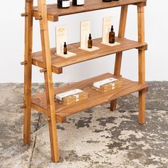 a wooden shelf with several bottles on it