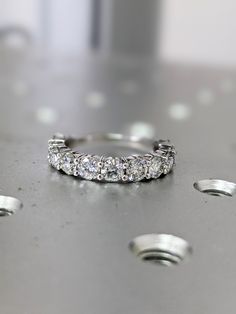 a close up of a wedding ring on a table