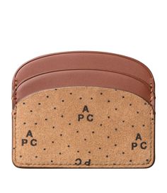 - Vegetable-tanned leather. - Suede split with the A.P.C. monogram. - Two card slots on each side. - One multifunction pocket in the center. - Rounded corners. - Embossed goldtone 'A.P.C. Rue Madame Paris' logo. C Monogram, Paris Logo, Faux Leather Bag, Backpack Tote Bag, Scarf Jewelry, Tote Backpack, Vegetable Tanned Leather, Weekender Bag, Hazelnut