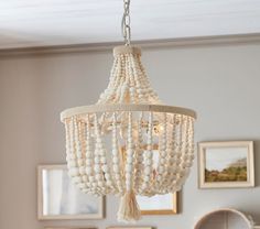 a white chandelier hanging from a ceiling