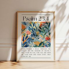 a framed poster with the words, paul 23 4 - 4 on it in front of a white wall