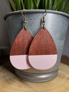 Hand Painted Teardrop Wood Earring - Teardrop Wood Earrings - Wood Earrings for Summer - Artisan Cute Wooden Earrings - Dangling Earrings These trendy cute earrings are hand-brushed in pastel pink color over a dark walnut stained wood.  A cute teardrop design that suits any clothing style or casual outfit perfect for this summer. Made with hypoallergenic bronze hooks and nickel free for sensitive skin. Height: 2.17 inch Width: 1.5 inch Drop Length: 3 inch These pair of earrings are lightweight a Pink Teardrop Beads For Jewelry Crafting, Pink Teardrop Jewelry Beads For Crafting, Teardrop Pink Jewelry For Crafting, Adjustable Teardrop Pendant Earrings As Gift, Brown Long Drop Earrings For Gift, Handmade Adjustable Pink Teardrop Earrings, Unique Teardrop Earrings, Pink Teardrop Earrings Gift, Handmade Teardrop Gift Earrings