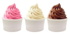 three different colored ice creams in white cups on a white background, one is pink and one is brown