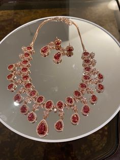 Beautiful Rose Gold CZ/AD necklace set with Ruby Red Italian colored crystals. Comes with necklace and earrings. Perfect for a wedding, party, or any special occasion.  Please feel free to reach out with any questions! Ad Necklace Set, Zircon Jewelry, Ruby Necklace, Beautiful Rose, Rain Drops, Color Crystal, Ruby Red, Beautiful Roses, Crystal Necklace