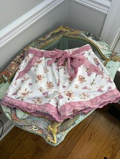 I love the white floral with the pink lace and I gave it a matching belt for you to configure to the style of your choice or simply go with out it. 

These are pre-owned, up-cycled shorts.  

Wash in cold and lay flat to dry, light iron on the lace.

Size US 8

Inseam 3"

Waist 28", High Waist

Top of belt to bottom lace is 13"

4 functional pockets Pink Lace Bottoms For Spring, Feminine Cotton Beach Shorts, Spring Cotton Shorts With Lace Trim, Cute Lace Trim Bottoms For Spring, Pink Lace Trim Shorts For Summer, Cute Lace Bottoms For Spring, Casual Pink Lace Bottoms, Feminine Bottoms With Lace Trim For Vacation, Feminine Bottoms With Lace Trim For Day Out