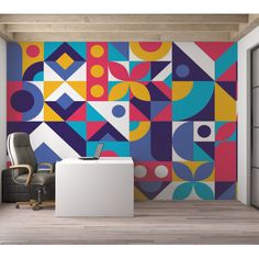 an office with colorful geometric wallpaper