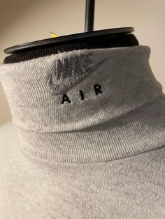 Vintage Nike Air Shirt  - Extremely rare  - Turtleneck style  - Nike Air spell out  - Swoosh logo neckline  - Mini swoosh grail  - Grey tag  - 90s vintage  Size: XL Great vintage condition  No rips or holes  No stains Long Sleeve Logo Tops In Athleisure Style, Athleisure Long Sleeve Tops With Logo, Sporty Fitted Tops With Logo, Fitted Sporty Tops With Logo, Casual Gray Logo Tops, Casual Gray Tops With Logo, Sporty Logo Tops For Fall, Nike Air Shirt, Turtleneck Style