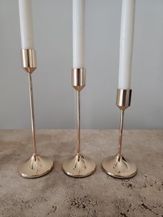 Set of 3 simple yet modern sleek single-headed rose gold/ champagne taper candlestick holders. A style addition to any home! * We can offer bulk orders (i.e. wedding) and offer a bulk discount. Depending on stock level we will need 3 weeks' notice to order. DETAILS - Material: Iron - They hold/fit most taper candles around Dia 2cm - Comes assembled DIMENSIONS: Please refer images SHIPPING: If you would like to purchase multiple items from our store, a combined discounted postage fee will be calc Gold Taper Candle Holders, Gold Taper Candles, Gold Candle Holder, Gold Champagne, Taper Candle Holders, Taper Candles, Champagne Gold, Candlestick Holders, Taper Candle