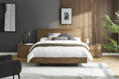 a large bed sitting next to a wooden dresser in a bedroom