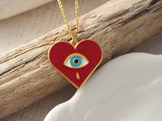 Gold red heart evil eye necklace, Gold stackable ring,Greek jewelry, Gold red heart charm, Valentine's red heart jewelry, Lover's jewellery Material and Size -Size of heart is 25,4 mm X 22,6 mm -Material :Gold plated 24 k Pewter with high quality red enamel which decorated with a colored ethnic evil eye -Pewter is very durable and is not tarnish easily If you follow care instructions also is lead and nickel free and is not causes allergic reactions Size of chain :This chain is made from stainles Red Enamel Jewelry For Anniversary, Teardrop Heart Charm Jewelry Gift, Spiritual Jewelry Gift For Valentine's Day, Spiritual Jewelry For Valentine's Day Gift, Spiritual Jewelry For Her On Valentine's Day, Handmade Heart-shaped Enamel Jewelry, Red Sterling Silver Jewelry For Gift, Personalized Red Jewelry For A Gift, Personalized Red Jewelry For Mother's Day