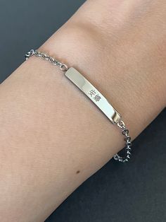 This listing is for a personalized engraved Chinese name mini bar bracelet in stainless steel. Stainless steel jewelry is strong and almost never tarnish or corrode. The sample bracelet is engraved with the name Anna in Chinese in the font #5 on the front and the date in the font #2 and a heart on the back of the bar. Please check the font options in the pictures: the font #3,4 & 5 is only written in traditional Chinese and #6 is only written in simplified Chinese. #1 and 2 is available for both Minimalist Personalized Metal Name Bracelet, Minimalist Personalized Stainless Steel Name Bracelet, Minimalist Stainless Steel Name Bracelet, Custom Name Stainless Steel Bracelet, Silver Rectangular Minimalist Name Bracelet, Minimalist Stainless Steel Friendship Name Bracelet, Silver Stainless Steel Name Bracelet For Friendship, Silver Stainless Steel Name Bracelet With Engraved Text, Minimalist Stainless Steel Name Bracelet As Gift