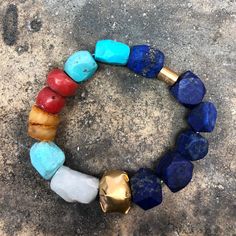 ANCIENT STONE BRACELET WITH 22K GOLD CLOSURE • DESIGNED AND HAND FORGED IN NEW YORK • STONES: LAPIS, TURQUOISE, CORAL, AND AMBER BEADS • LENGTH: 6.5 INCHES Please email info@elihalili.com or call the studio at 212-941-7979 for any inquiries. Artisan Gold Beaded Bracelets With Natural Stones, Luxury Bangle Bracelet With Natural Stones, Luxury Multicolor Gold Bracelet As A Gift, Luxury Multicolor Gold Bracelet As Gift, Luxury Multicolor Gold Bracelet For Gift, Fusion Style Yellow Gold Bracelet As Gift, Fusion Style Yellow Gold Bracelet Gift, Yellow Gold Fusion Style Bracelets As Gift, Yellow Gold Fusion Bracelets For Gifts