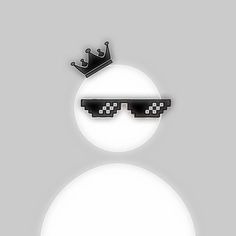 a snowman wearing sunglasses with a crown on top