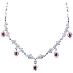 This classic cocktail necklace features 5.12 carats of baguette and round diamonds (VS quality) with 2.50 carats of vivid red rubies. The diamonds and rubies are set halfway up the necklace and set in 18K white gold. Quality made piece of high jewelry. Length 16.25 inches Red Diamond Necklace, Most Expensive Pearl, Red Ruby Necklace, Red Jewellery, Ruby And Diamond Necklace, Cocktail Necklace, Royal Core, Gold Drop Necklace, Diamond Drop Necklace