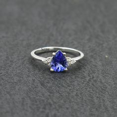 Tanzanite Birthstone Ring With Accent Stones For Promise, Tanzanite Birthstone Promise Ring With Accent Stones, Anniversary Tanzanite Birthstone Ring, Tanzanite Birthstone Promise Ring, Tanzanite Birthstone Ring With Prong Setting Gift, Classic Tanzanite Birthstone Promise Ring, Tanzanite Solitaire Birthstone Ring As Gift, Aquamarine Ring Vintage, Blue Aquamarine Ring