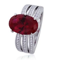 a ring with a large red stone surrounded by two rows of white gold and diamonds