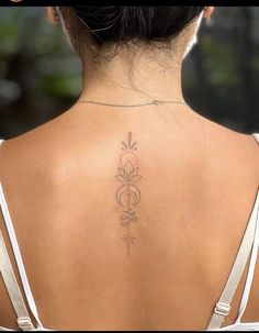 a woman with a tattoo on her back