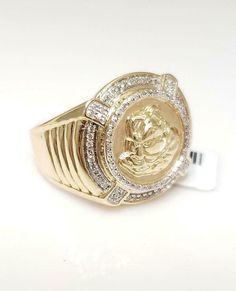 This sleek 10-karat yellow men's ring showcases a Medusa head and weighs 9 grams. The ring showcases .25 carats of sparkling round diamonds and shines with a high polish finish. Will come in a gift box. Diamonds: Genuine Round Cut Sparkling Diamonds Carats: .25ctw Color: G-H Clarity: SI2-SI3 Width: 19mm Height: 6mm Weight: 9 grams Hallmarked: 10kt Size: 10 (resize is available) 100% Satisfaction COMES WITH RING BOX Mall Price: $2,775.00 093021.39201SHCS.TCC.AV-247704Y Medusa Head, Exclusive Jewelry, Men's Ring, Sparkle Diamonds, Ring Box, Round Cut, Round Diamonds, Cuff Bracelets, Rings For Men