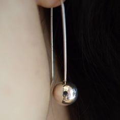 "ball earrings sterling silver beads, dangle ball earrings, Long contemporary earrings, simple jewelry, modernist gift for her High polished ball simple earrings in sterling silver Lovely for everyday and casual dressing. The shiny balls are 10mm and the total length is 40 mm -1.50\" inches All our items comes beautiful wrapped. if you need additional information please don't hesitate to contact me You can see more shop listings here: http://www.etsy.com/shop/nikiforosnelly" Minimalist Sphere Earrings For Everyday, Minimalist Sterling Silver Sphere Earrings, Casual Dressing, Contemporary Earrings, Ball Earrings, Earrings Simple, Earrings Long, Simple Earrings, Simple Jewelry