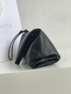 SHOP MORE LUXURY PRODUCTS HERE Description Bottega Veneta Clutch Black, For Women, Women’s Bags 13in/33cm Size: 13 x 33 x 8 cm /5.1 x 13 x 3.1 inches (Height x Width x Length) Single compartmentMagnetic frame closure Includes dust bag.This product is of the premium quality. Designer Black Top Handle Pouch, Luxury Black Satchel Pouch, Black Leather Handheld Pouch, Designer Handheld Clutch With Top Carry Handle, Designer Evening Pouch With Detachable Handle, Elegant Pouch With Top Carry Handle, Elegant Pouch With Top Carry Handle For Everyday Use, Black Leather Top Handle Pouch, Designer Evening Shoulder Bag Pouch