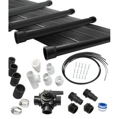 an assortment of pipes, fittings and accessories for a water heater system on a white background