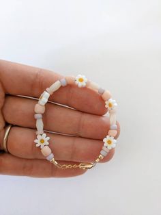 Beautiful Daisy Bead Bracelets with 14k Gold filled. 🤍Perfect for summer bracelets for babies, young girls and Mamas! 🤍 Gold findings on all clasp bracelets, so these will NOT tarnish.  🤍 Extender chain of 1/2 inch.  🤍Perfect baby gift, birthday gift, shower gift, or baby announcement!  🤍All bracelets come packaged and ready to gift.  🤍 Please message me for any questions or custom instructions.