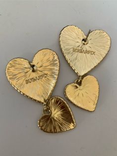 Goldtone fashion quilted heart shaped earrings.  Approximately 1" x 2".  Shiny bright and lovely for a summer outfit.  Would show through long hair. Trendy Gold Double Heart Earrings, Heart Fashion, Heart Shaped Earrings, Summer Outfit, Fashion Earrings, Jewelry Earrings Dangle, Long Hair, Heart Shapes, Dangle Drop Earrings