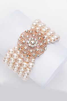 This sumptuous piece of jewelry features a retro-elegant yet slightly modern style that complements the lavish garments, reminiscent of the roaring 1920s. Features: High quality Austrian crystals and imitation pearls Five strand design 5.5 inch / 14cm in diameter 8mm pearls Roaring 20s Accessories, 20s Accessories, 1920s Accessories, Gatsby Headband, 1920s Jewelry, Beaded Evening Bags, Women's Bracelets, Roaring 20s, Ladies Clutch