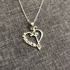 "This music note necklace can be made into necklace, bracelet, earring and more... Please specify your 'name' to be crafted in the order note. Base Material: Sterling Silver Size: 22mm X 28mm Chain Length: 14'' - 24'' Inches Metal Stamped: 925 Thickness: 1.5mm Crafting Time: 7 - 10 working days Durable Plating: Rose Gold or Gold (Selectable with additional fee of USD 10) You'll receive Order Shipped Email from us when your item is completed and shipped. SPECIAL ANNOUNCEMENT 1. Please visit https Heart-shaped Music-themed Jewelry Gift, Music-themed Heart-shaped Jewelry Gift, Nickel-free Sterling Silver Music-themed Necklace, Silver Heart-shaped Music-themed Jewelry, Music-themed Silver Heart Jewelry, Music-themed Pendant Jewelry For Gifts, Nickel-free Music-themed Jewelry As Gift, Music-themed Pendant Jewelry As Gift, Music-themed Pendant Jewelry Gift