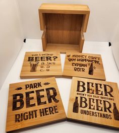 four wooden coasters with different types of beer on them and the words park, beer, right here