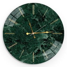 a green marble clock with gold hands and numbers on it's face is shown