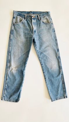 Natural waist, 4 pocket, non stretch jeans. Great vintage wear and fading. 100% cotton.  Waist: 16.5" Hips: 21" Rise: 11" Inseam: 29" Hem: 8" Medium Wash Rigid Denim Jeans With Frayed Hem, Distressed Medium Wash Cropped Jeans, Washed Blue Jeans With Frayed Hem In Rigid Denim, Medium Wash Distressed Straight Leg Jeans, Faded Distressed Straight Leg Jeans, Mid-rise Distressed Faded Cropped Jeans, Faded Distressed Mid-rise Cropped Jeans, Fitted Pre-washed Blue Jeans, Distressed Medium Wash Cropped Rigid Denim Jeans