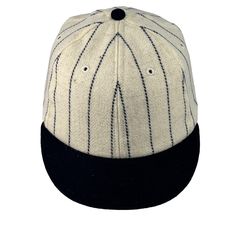 Addition on navy felt number 4 on front of this ultimate baseball cap is custom made to order. Cut from American custom woven wool to the exact specification of the old Yankees Babe Ruth era fabric.  This Exclusive wool is natural and durable, comfortable and classic. The color is cream/white wool, with navy pinstripes. Order yours today in any size, fitted with a brushed cotton sweatband with a soft felt absorbent center. The visor shown is our 2" vintage size with a dark green wool under visor. Prefer another length visor? Select your choice at checkout. Navy Fitted Hat With Flat Brim For Baseball Season, Navy Flat Brim Fitted Hat For Baseball Season, Classic Flat Cap Fitted Hat For Sports Events, Adjustable Wool Hat With Flat Bill, Classic Adjustable Wool Baseball Cap, Classic Fitted Baseball Cap For Baseball Season, Classic Fitted Baseball Cap, Classic Flat Bill Hat For Baseball Season, Classic Snapback Hat For Baseball Season